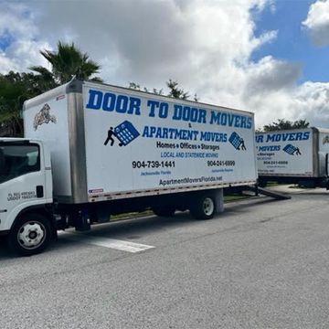 Long Distance Moves — Boxes on ground near moving van in Jacksonville, FL