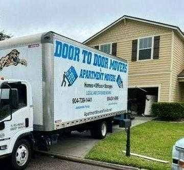 Statewide Moving — Family Carrying Boxes Into New Home On Moving Day in Jacksonville, FL