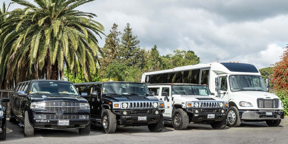 A group of vehicles are parked next to each other in a parking lot.