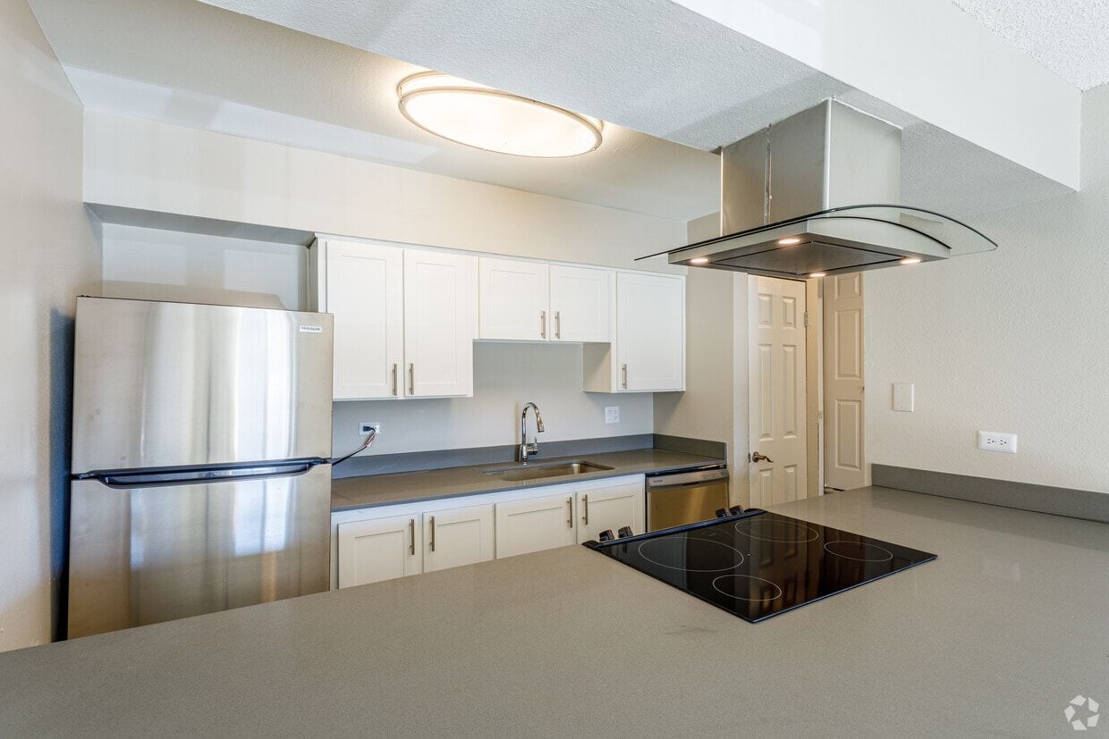 Modern kitchen with stainless steel appliances and sleek countertops