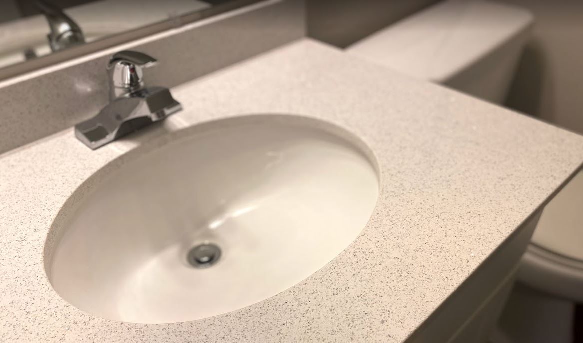 Close-up view of a bathroom sink with a countertop