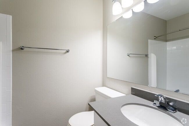 Modern bathroom with a sink, toilet, and shower