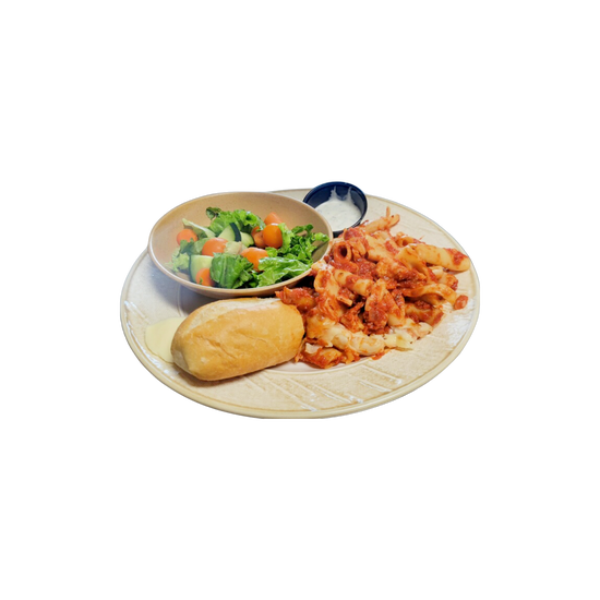 Plate of food: pasta with sauce, salad, bread roll, and dipping sauce.