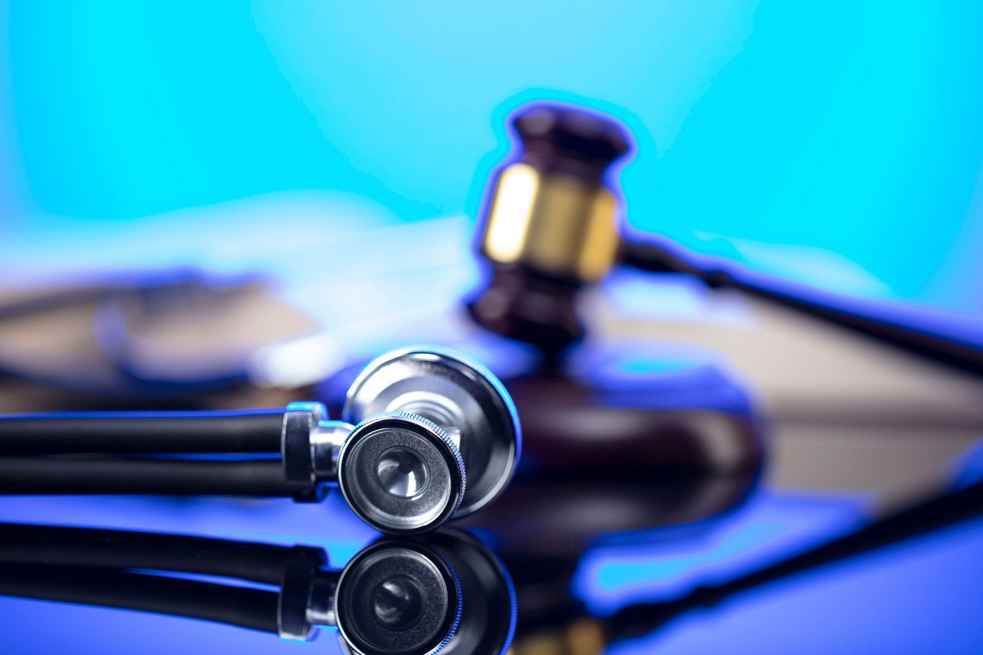 Stethoscope And Gavel In Blue Background — The Law Offices Of Cardaro & Peek, LLC