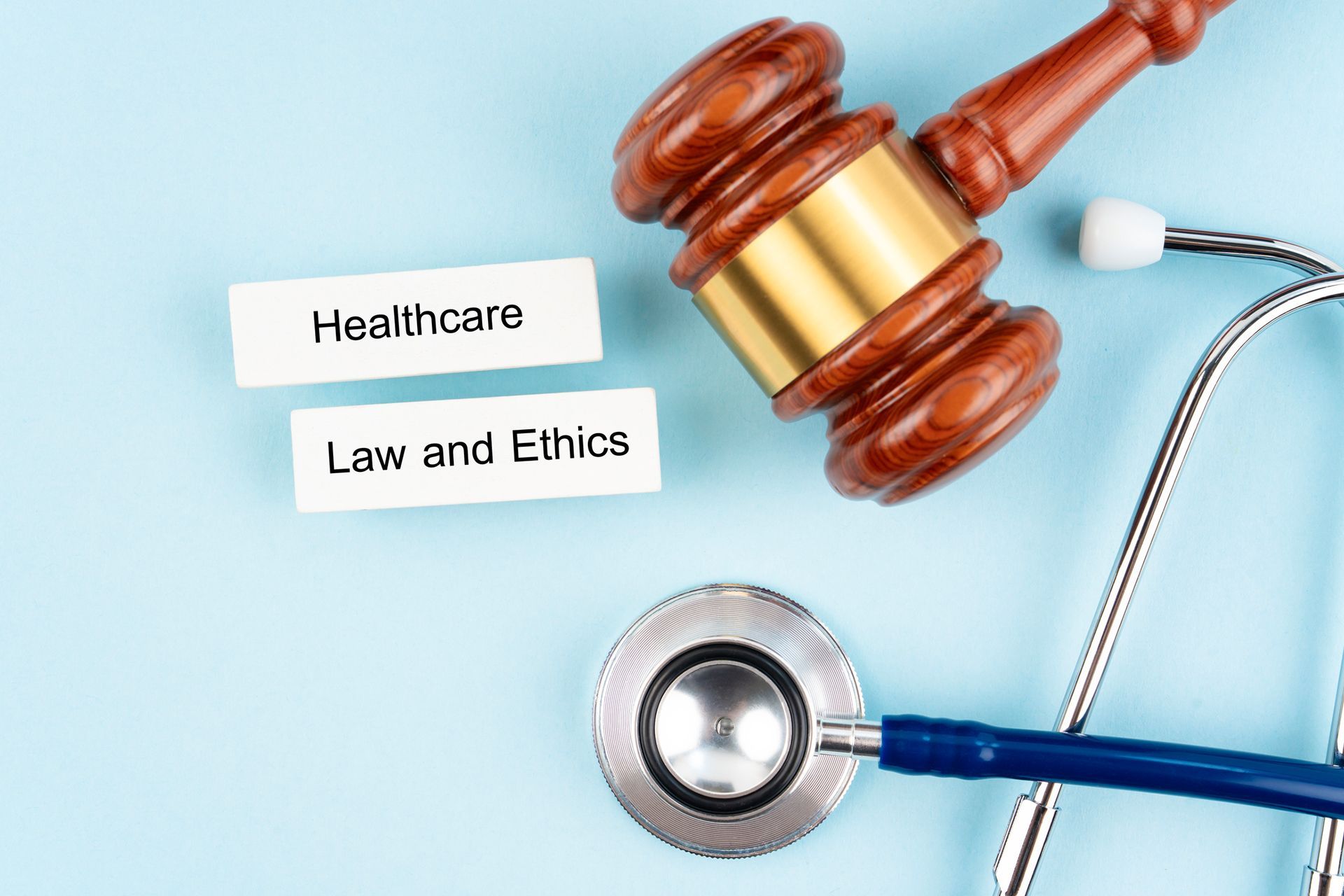 Wooden gavel, stethoscope, and labels Wooden gavel, stethoscope, and labels