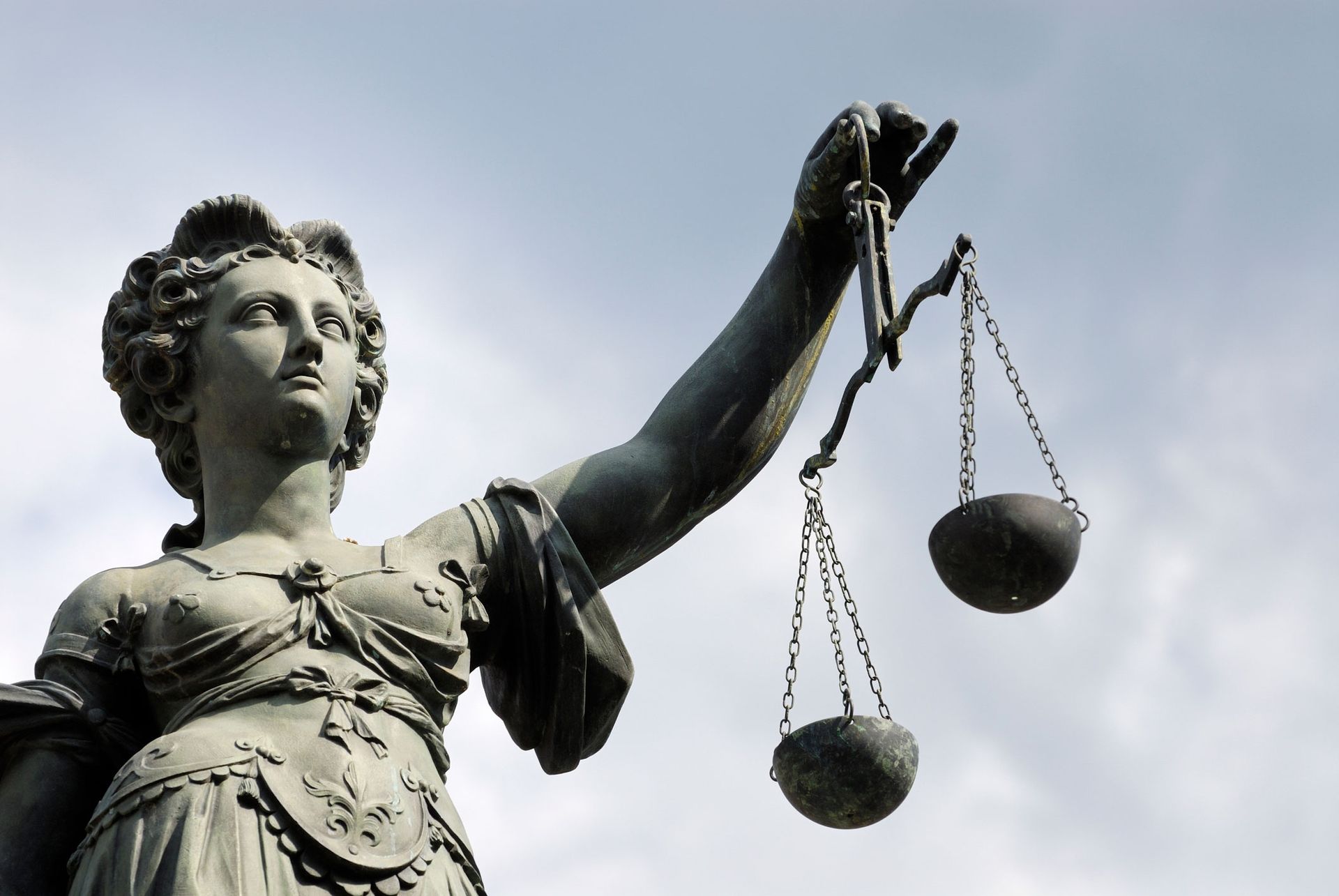 A Statue Of Justice Holding Scale — The Law Offices Of Cardaro & Peek, LLC