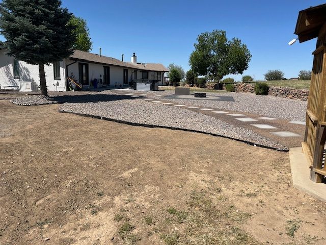 A house with a lot of rocks in front of it