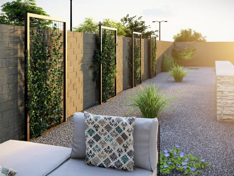 Backyard patio with climbing plants on a stone wall, gravel ground, and lounge seating.