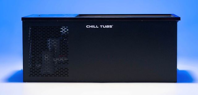A black chill tub is sitting on a blue surface.