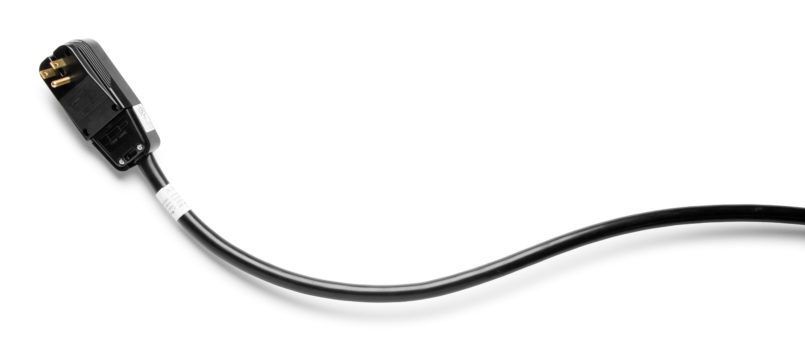 A close up of a black cord on a white background.