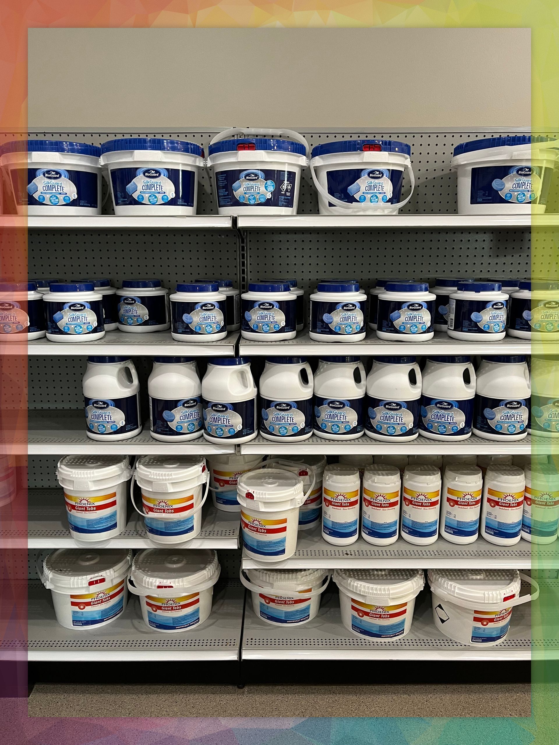 A store shelf filled with buckets and bottles of pool chemicals.