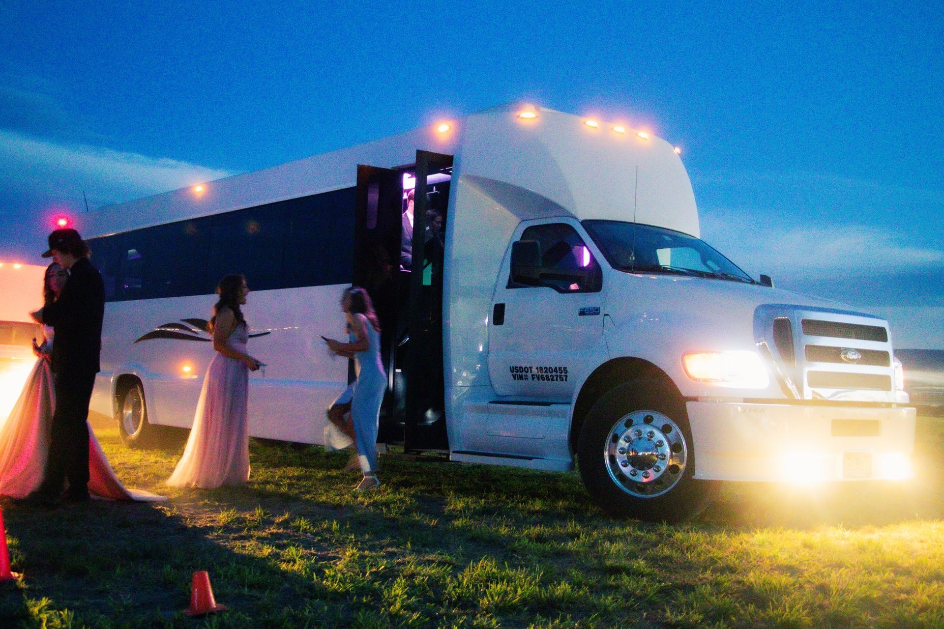 A large room with tables and chairs set up for a wedding reception.