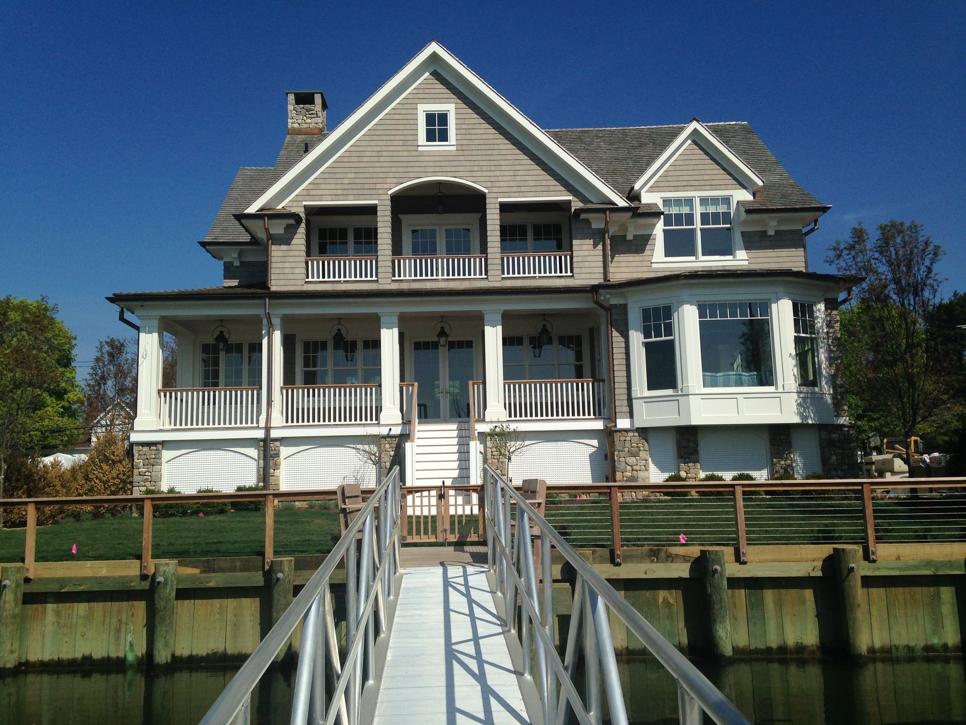 A large house with a dock in front of it