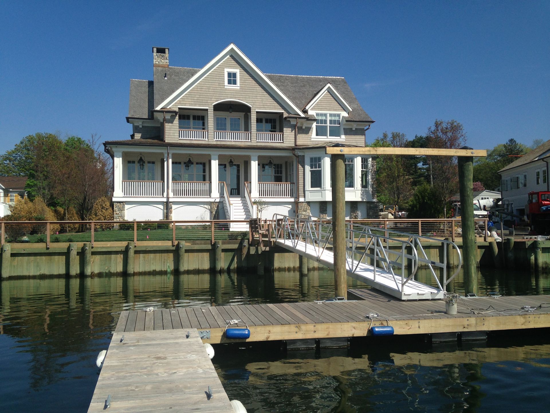 A large house with a dock in front of it