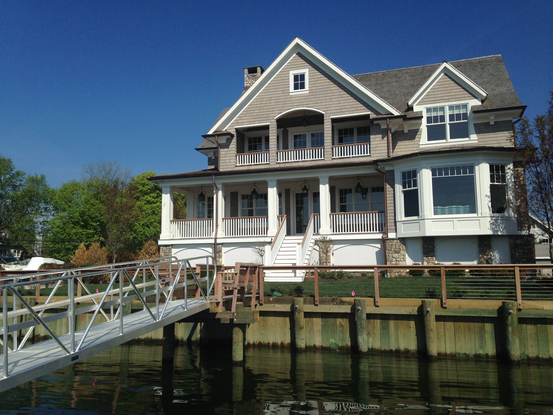 A large house with a dock in front of it