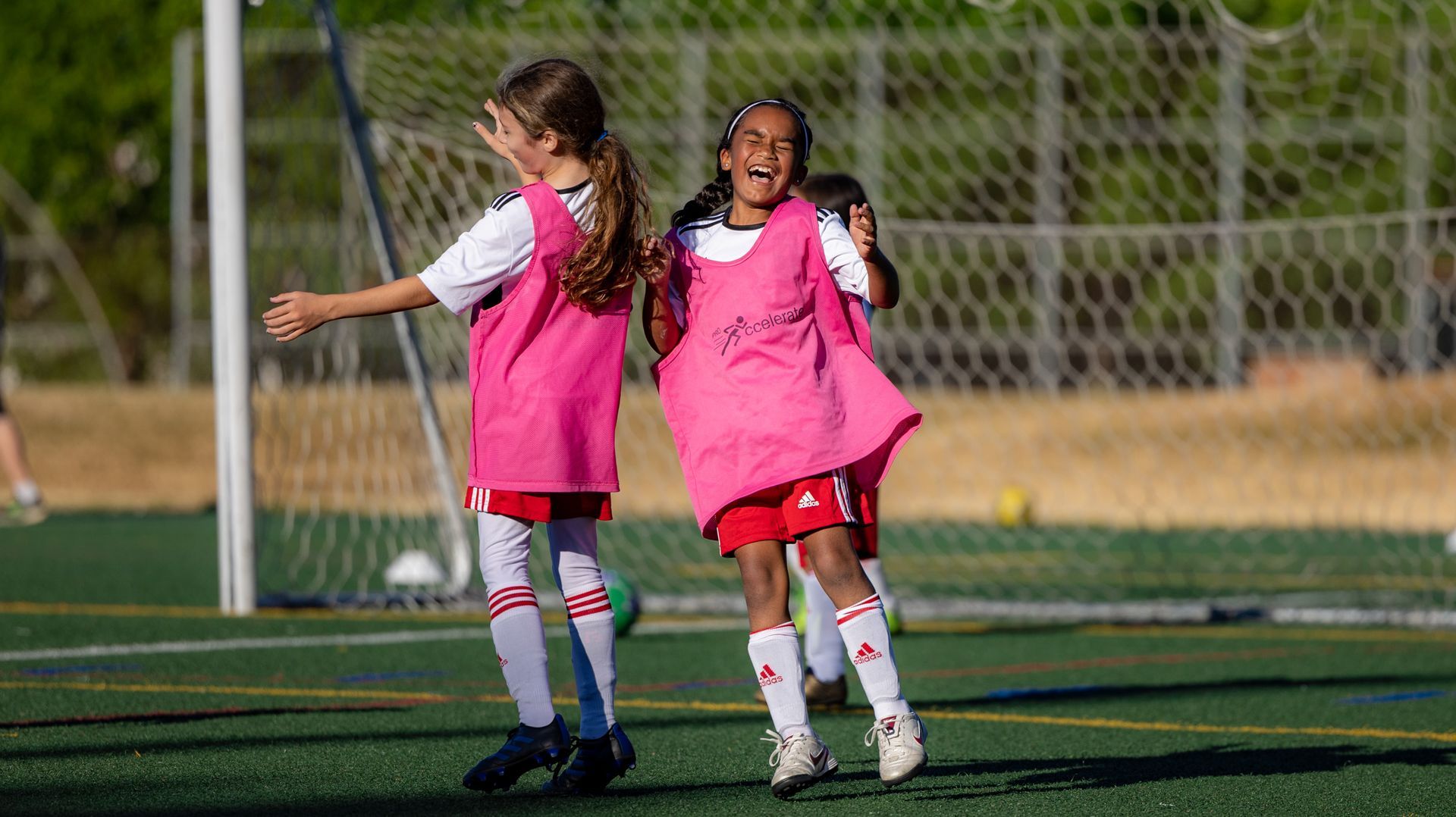 two players mid air touching each others shoulder