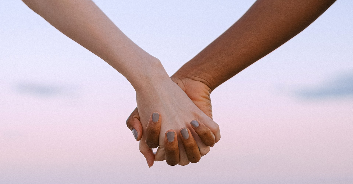 Close up of two hand clasped together