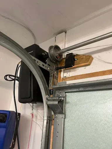 A close up of a garage door opener in a garage.