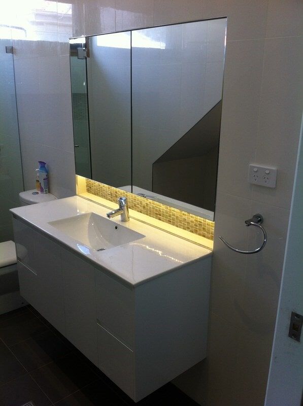 A Bathroom with A Sink and A Mirror — Burns Custom Kitchens in Newcastle, NSW
