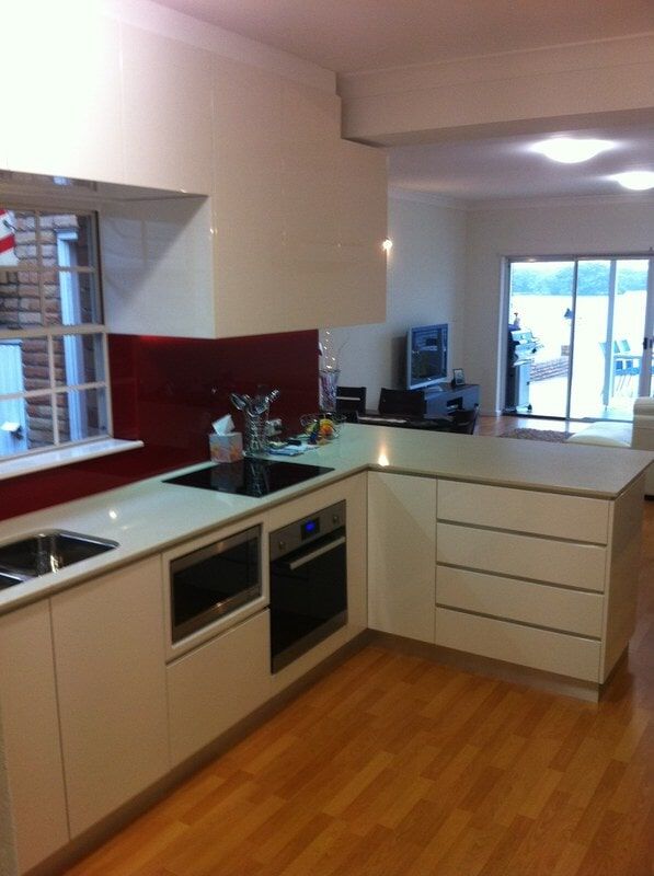 A Kitchen with White Cabinets and Stainless Steel Appliances — Burns Custom Kitchens in Newcastle, NSW