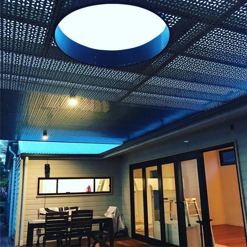 A Patio with A Blue Ceiling and A Table and Chairs — Burns Custom Kitchens in Newcastle, NSW