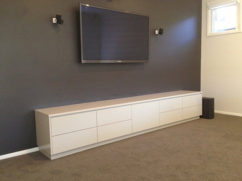 A Living Room with A Flat Screen Tv on The Wall — Burns Custom Kitchens in Newcastle, NSW