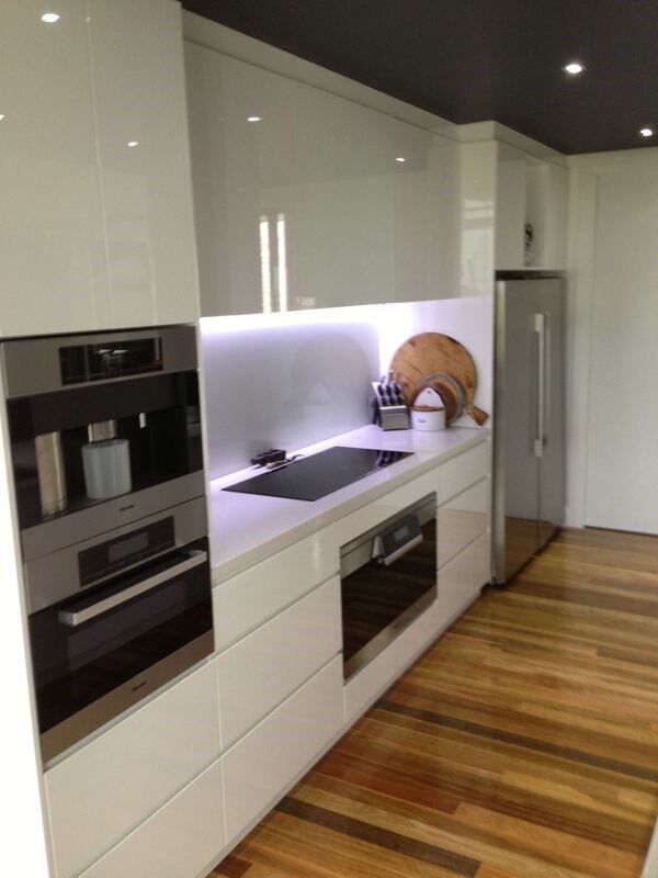 A Kitchen with White Cabinets and Stainless Steel Appliances — Burns Custom Kitchens in Newcastle, NSW