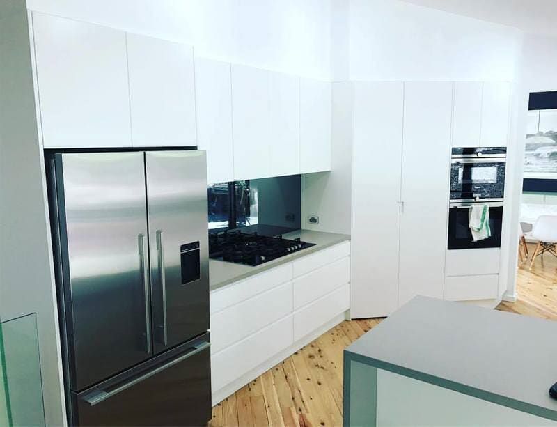 A Kitchen with White Cabinets and Stainless Steel Appliances — Burns Custom Kitchens in Newcastle, NSW