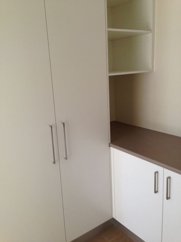 A Corner of A Room with White Cabinets and Shelves — Burns Custom Kitchens in Newcastle, NSW