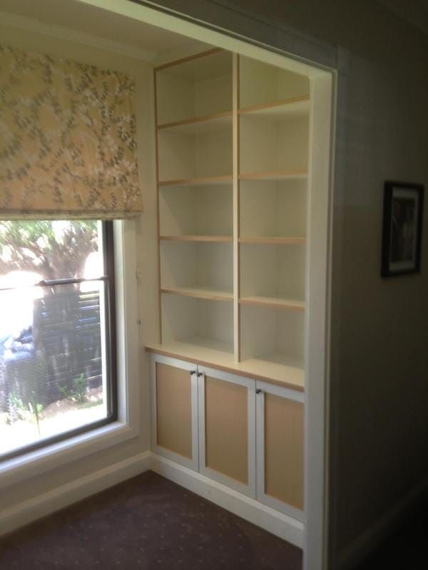 A Corner of A Room with Shelves and A Window — Burns Custom Kitchens in Newcastle, NSW