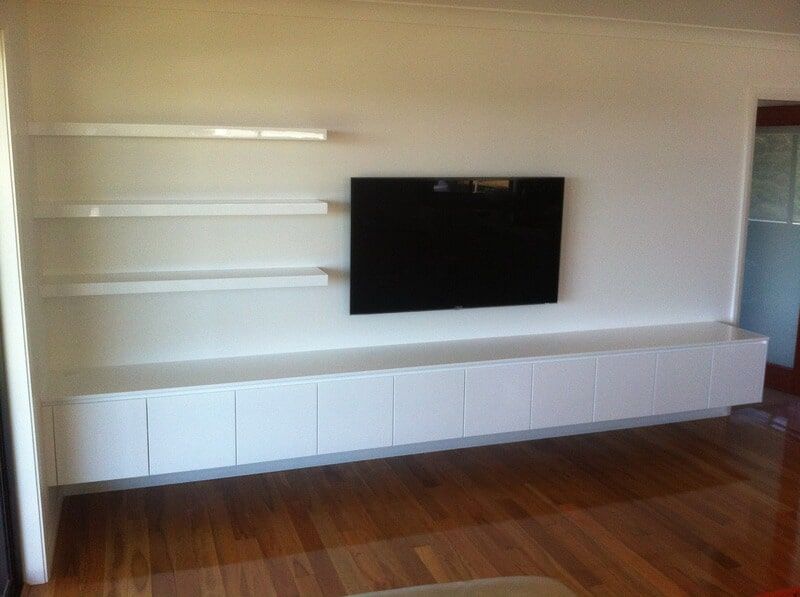 A Living Room with A Flat Screen Tv on The Wall — Burns Custom Kitchens in Newcastle, NSW