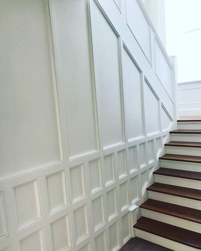 A Staircase with Wooden Steps and White Paneling on The Wall — Burns Custom Kitchens in Newcastle, NSW
