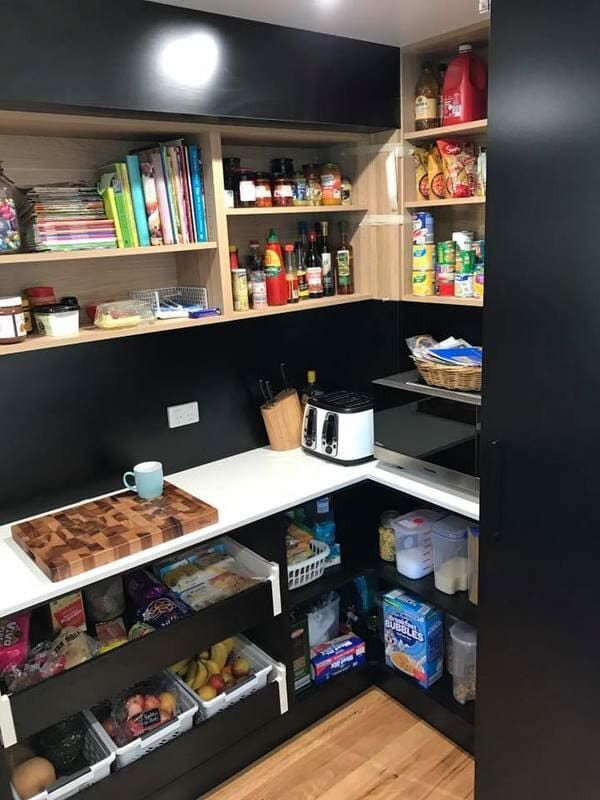 A Kitchen with A Pantry Filled with Food and A Toaster Oven — Burns Custom Kitchens in Newcastle, NSW