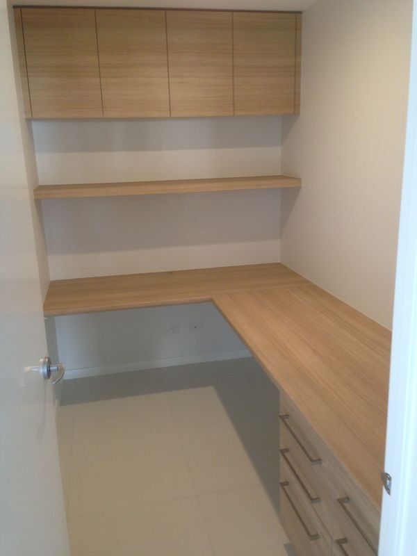 A Small Room with A Wooden Desk and Shelves — Burns Custom Kitchens in Newcastle, NSW