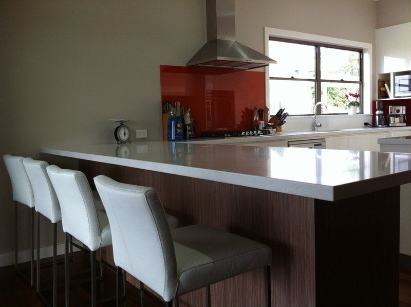 A Kitchen with White Chairs and A Counter Top — Burns Custom Kitchens in Newcastle, NSW