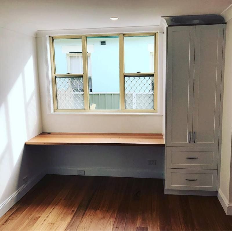 A Room with A Window, a Desk, and A Wardrobe — Burns Custom Kitchens in Newcastle, NSW