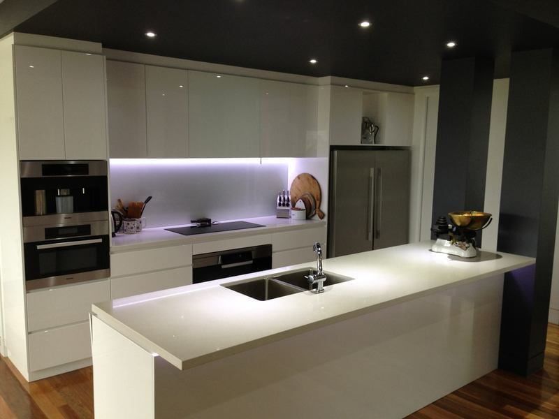 A Kitchen with White Cabinets and Stainless Steel Appliances — Burns Custom Kitchens in Newcastle, NSW