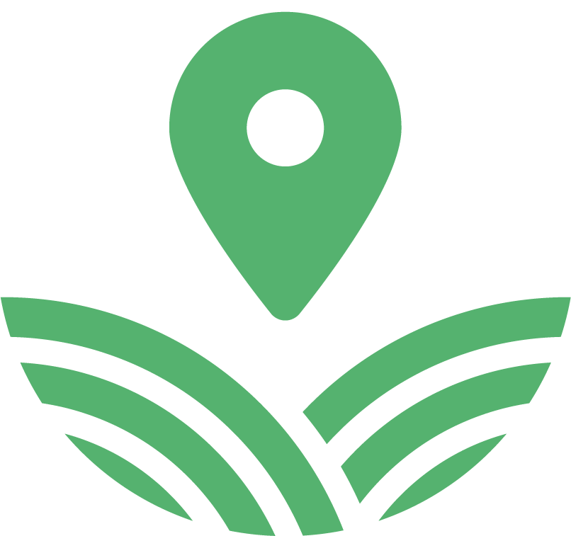 A green star with a check mark on it is sitting on top of a field.