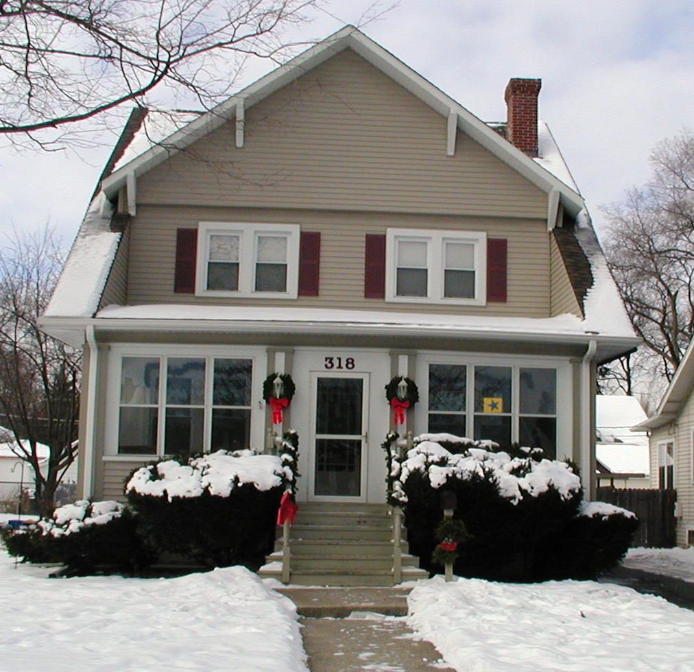 A house with the number 318 on the front of it