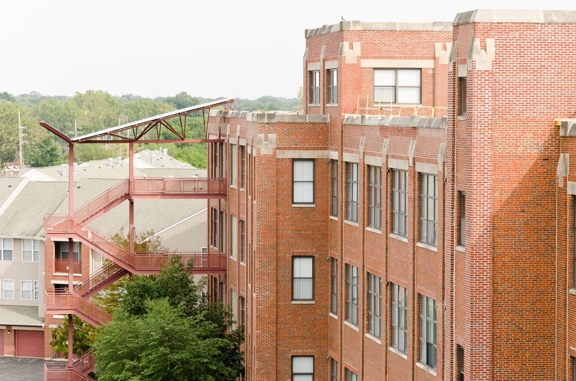 A large brick building with a fire escape on the side