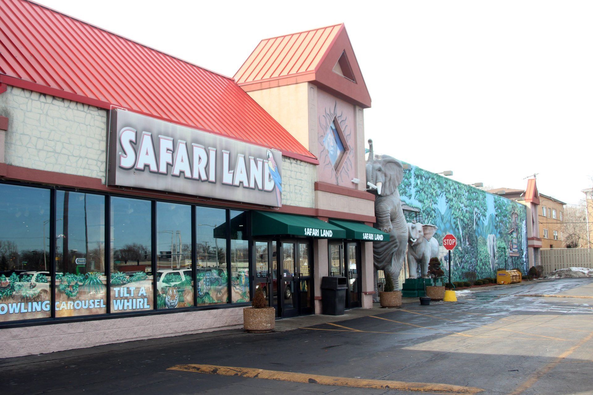 A safari land store with a red roof