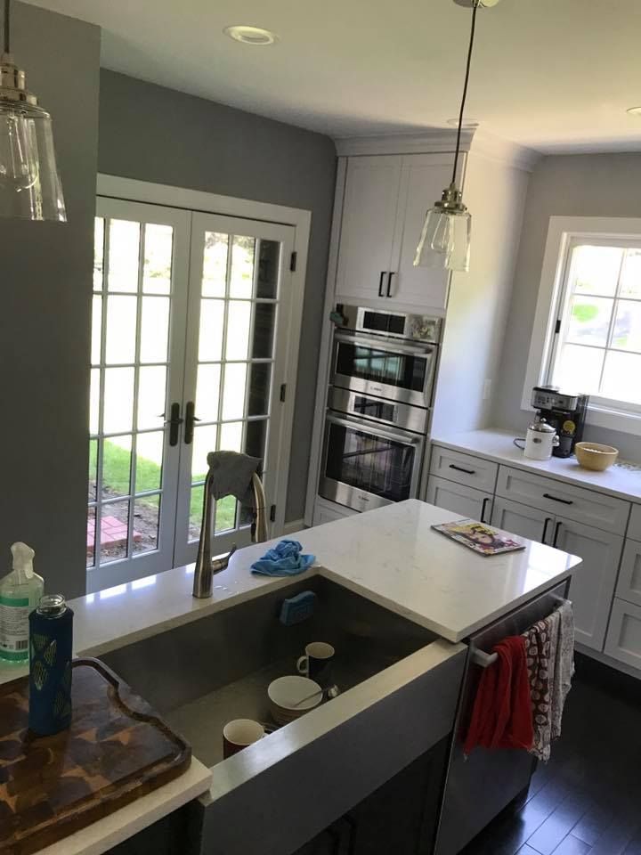 A kitchen with stainless steel appliances and a sink.