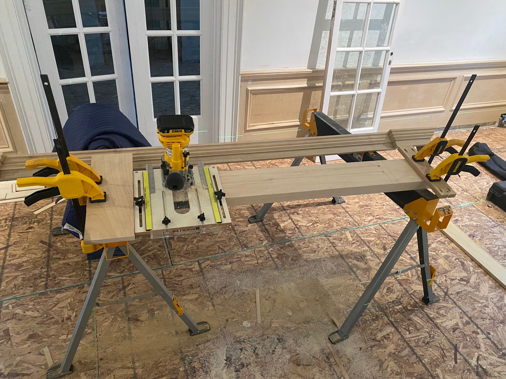 A piece of wood is sitting on top of a workbench.