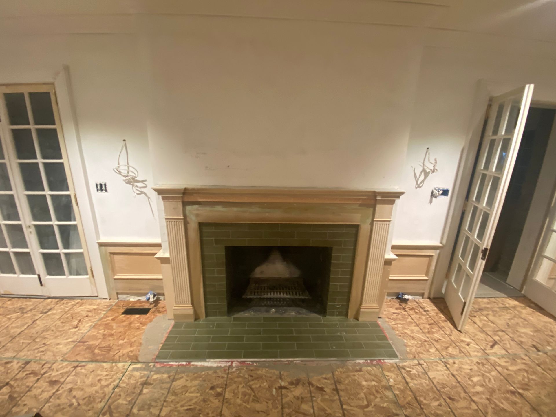 There is a fireplace in the middle of the room.