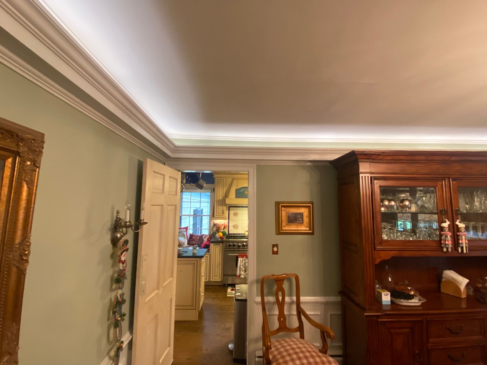 A living room with a ceiling light and a chair.