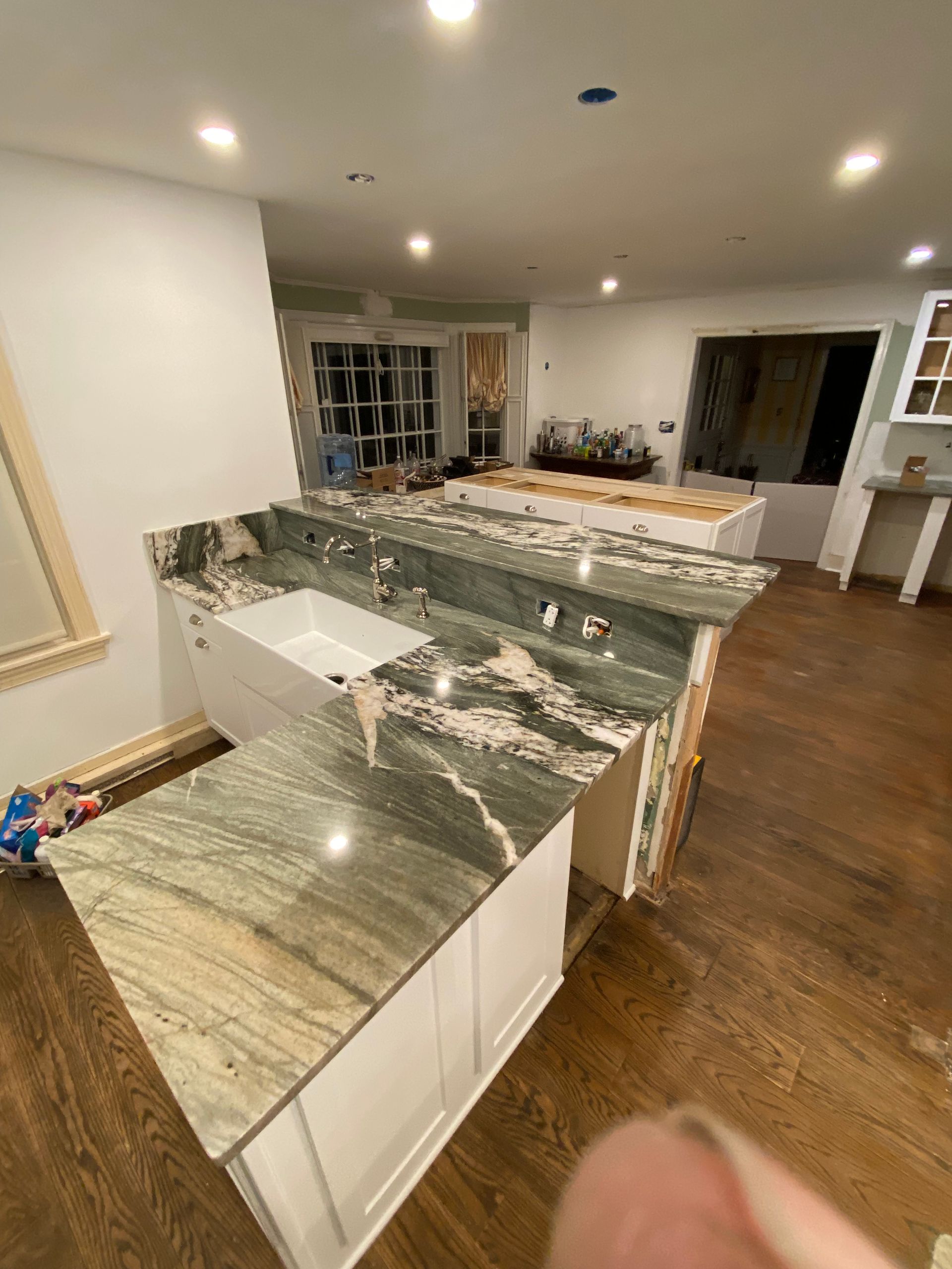 A kitchen with granite counter tops and a sink.