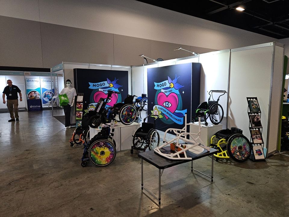 A Display Of Wheelchairs And A Table In A Room — Mogo Wheelchairs In Bankstown, NSW