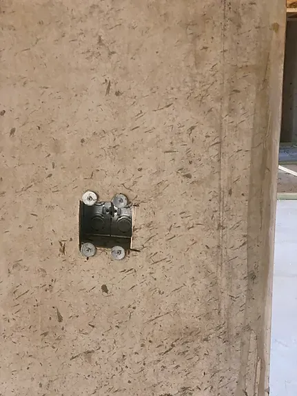 A close up of a wall with a hole in it.