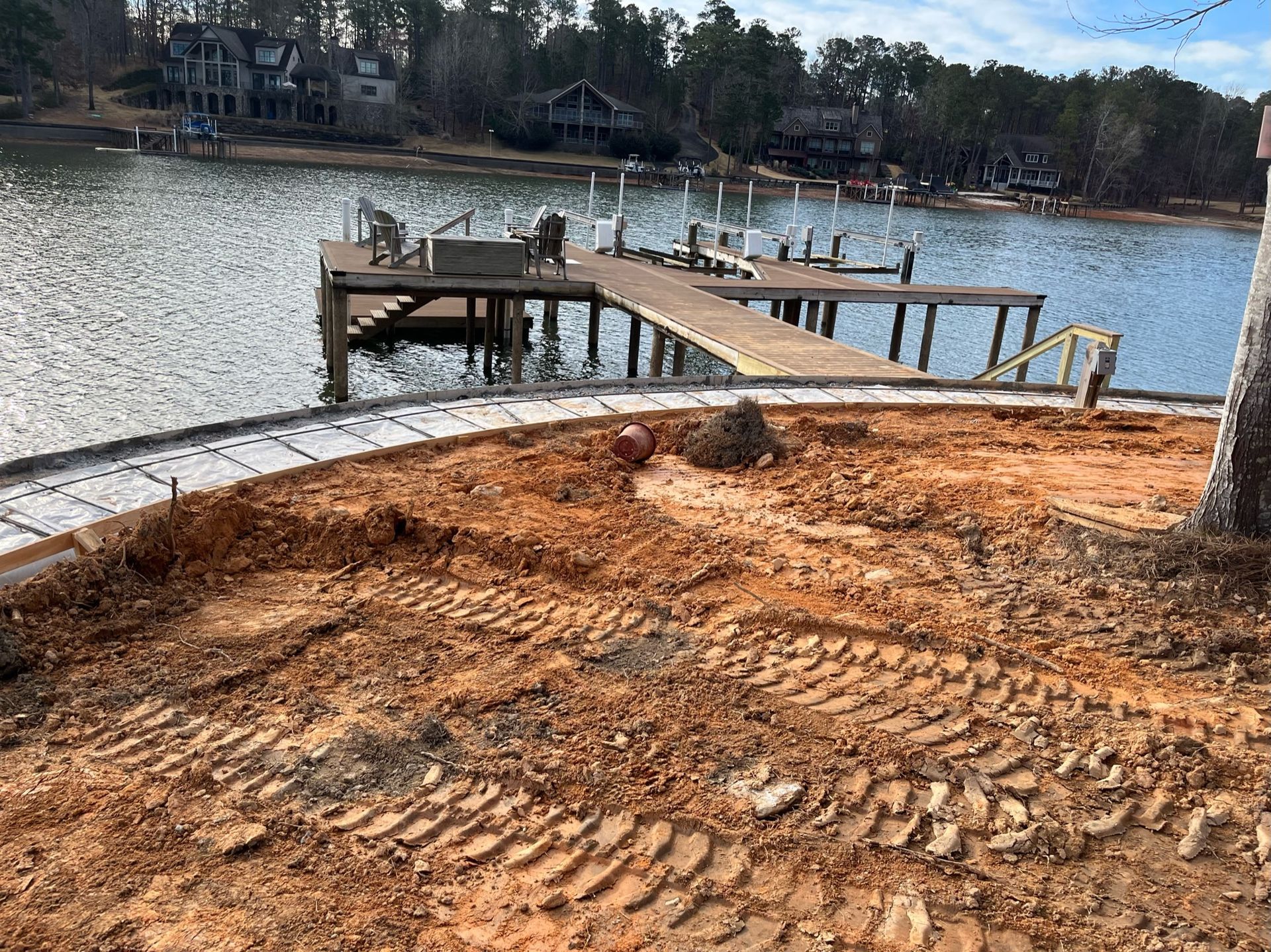 A dock is being built on the shore of a lake.
