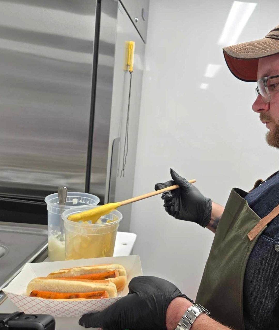 Owner preparing food in his food truck.